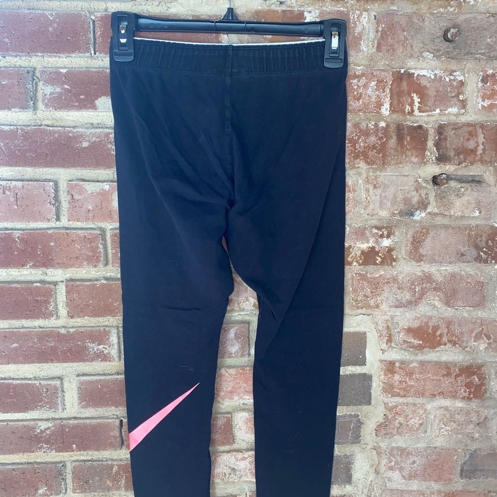 Women’s pink logo Nike leggings
